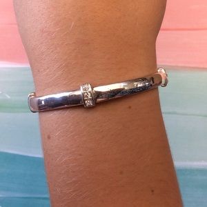 Silver tone stretchy bracelet with hidden “love”